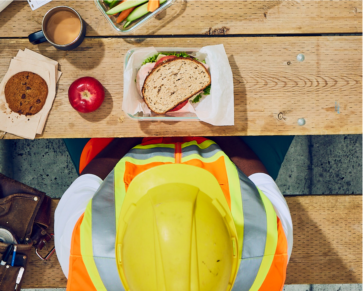 Man in construction outfit with hearty lunch