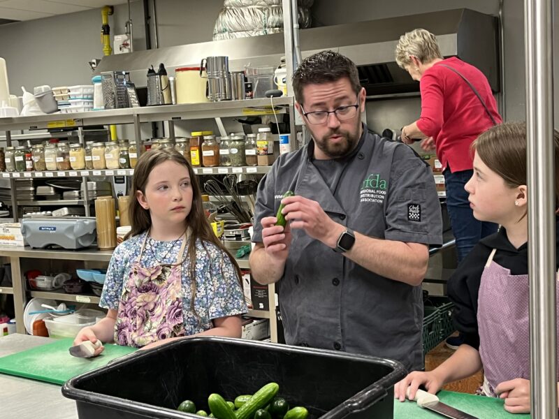 people preparing cucumbers