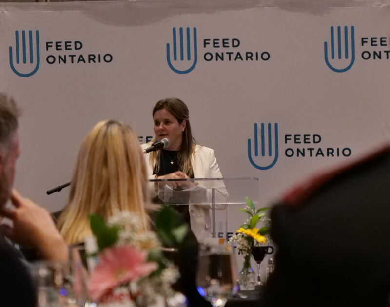 Carolyn Stewart, Feed Ontario CEO, presenting the leadership awards at our conference.