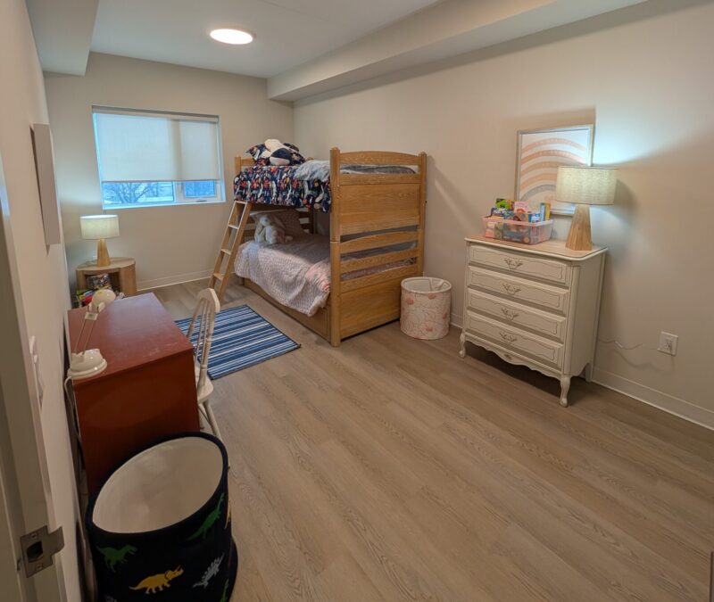 A child's bedroom, furnished in the affordable housing building.