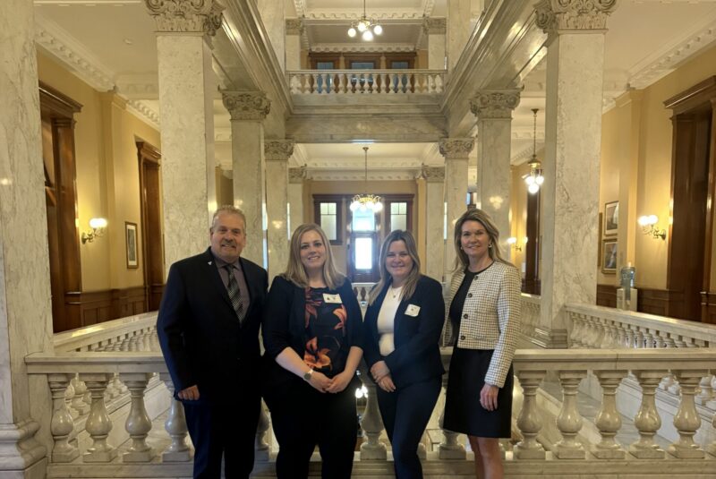 Feed Ontario senior leadership pictured with Minister Dunlop and an MPP at Queen's Park.