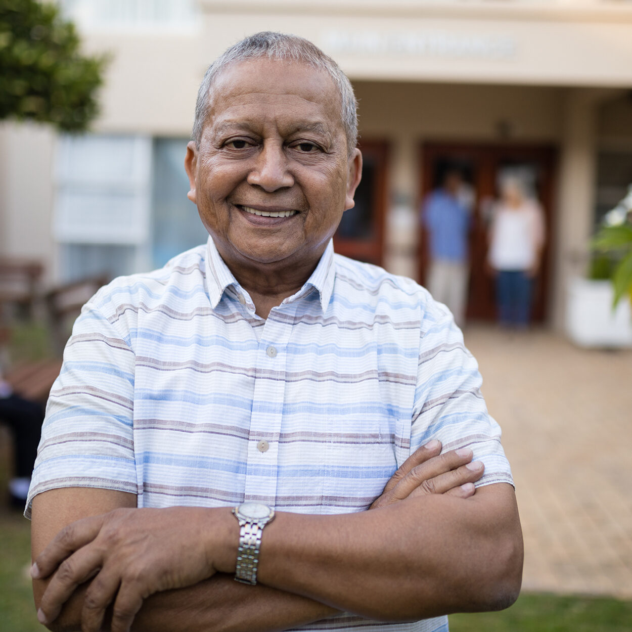 A photo portrait of a smiling man